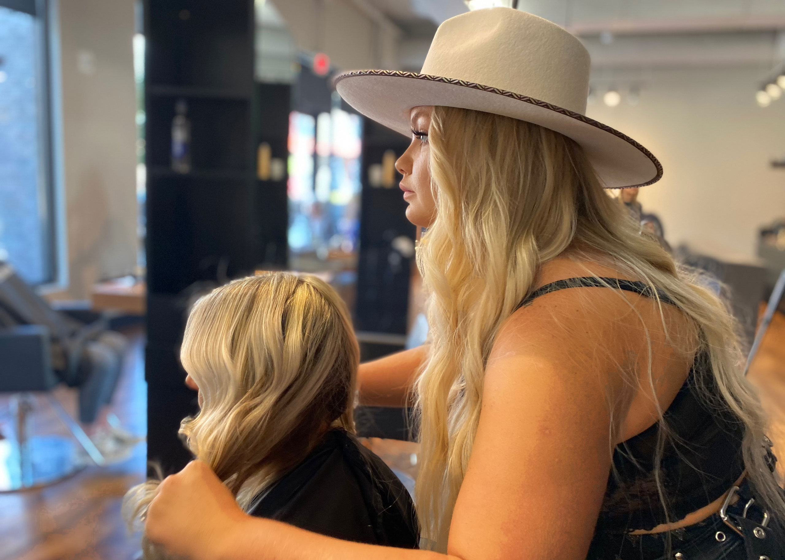 stylist at studio be salon in loveland colorado with client